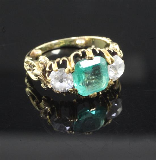 A late Victorian emerald and diamond three stone ring, size I/J